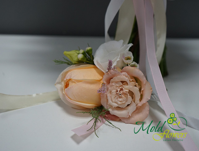 Bridal bouquet with pink roses, eustoma, and eucalyptus + boutonniere photo